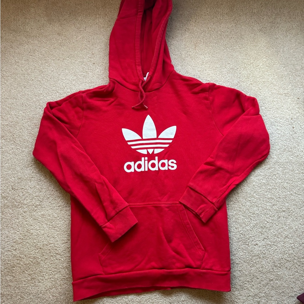 Red Adidas hoodie.